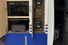 Rear bulkhead cabinet showing instructor station and audio amplifiers.