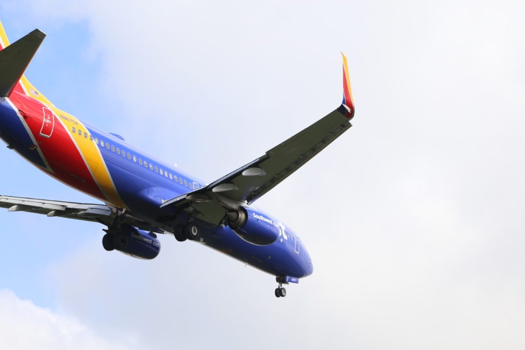 A Boeing 737-800 flying overhead to land.  Copyright SimObsession.com.