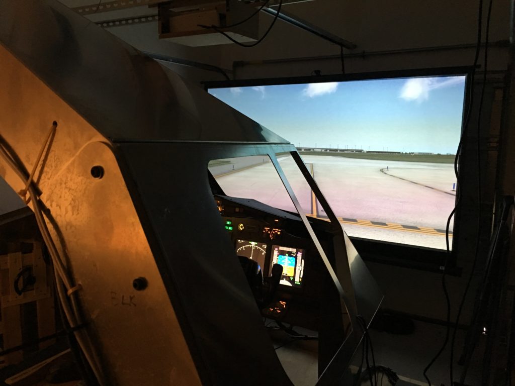 My Boeing 737-800 simulator using a single projection screen for visuals