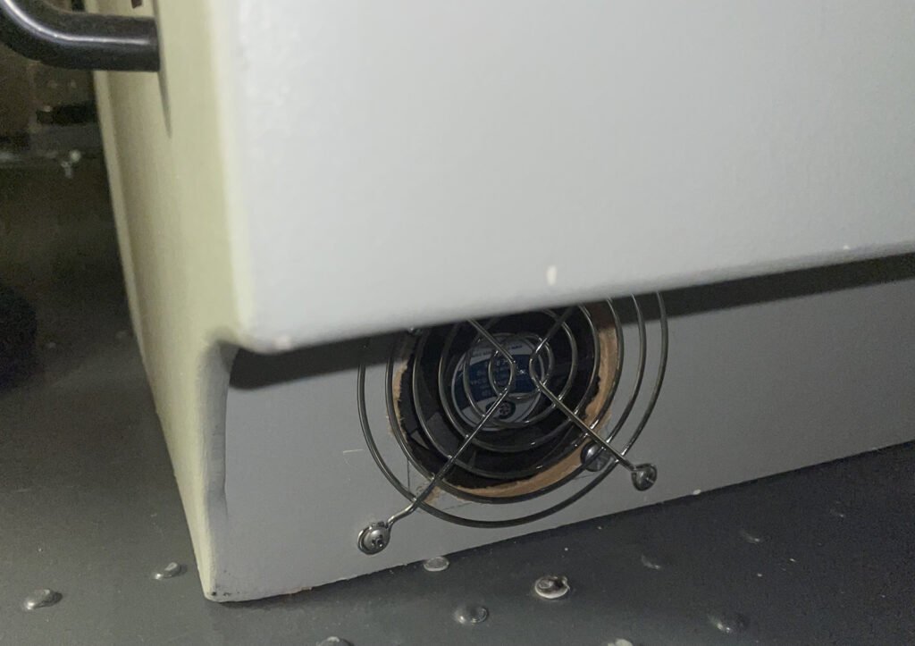 A small, quiet CPU fan installed at the bottom of my pedestal to extract heat from inside.